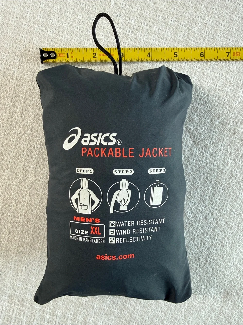 Asics packable jacket folds into pocket dark gray size XXL orange accents